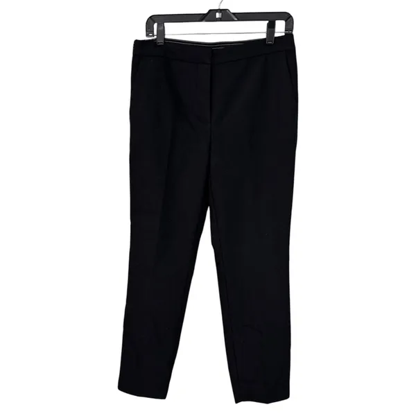 ZARA BASIC Collection Black trousers zip hem Back stripe straight leg size Lg The ZARA BASIC Collection Black trousers are stylish dress pants in size L with a zip hem feature and back stripe accents. Made from a fabric blend of blended polyester, these pants have a straight leg style and pockets for added convenience. Perfect for casual occasions in the summer, fall, and spring, these trousers are machine washable for easy care. The black pants with stripes offer a city-inspired theme, making them a versatile and chic addition to any woman's wardrobe. - Image 2