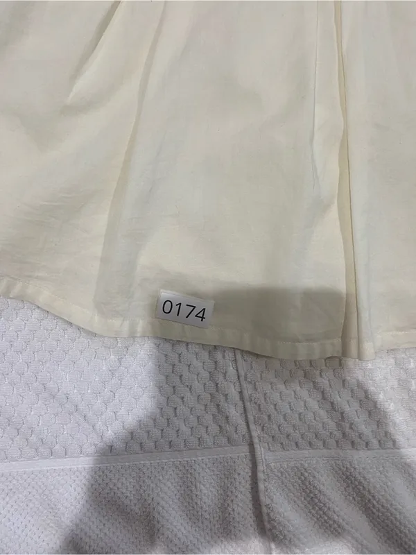 Cream Sleeveless Mini Dress with Eyelet Bodice - Image 2