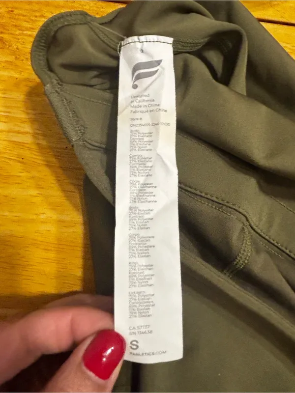 Fabletics Motion 365 onesie in olive green features a racerback design - Image 10