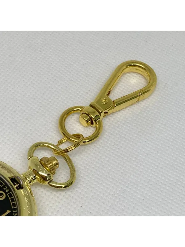joy & iman Women’s gold tone pocket watch black dial Quartz analog 46mm running - Image 3