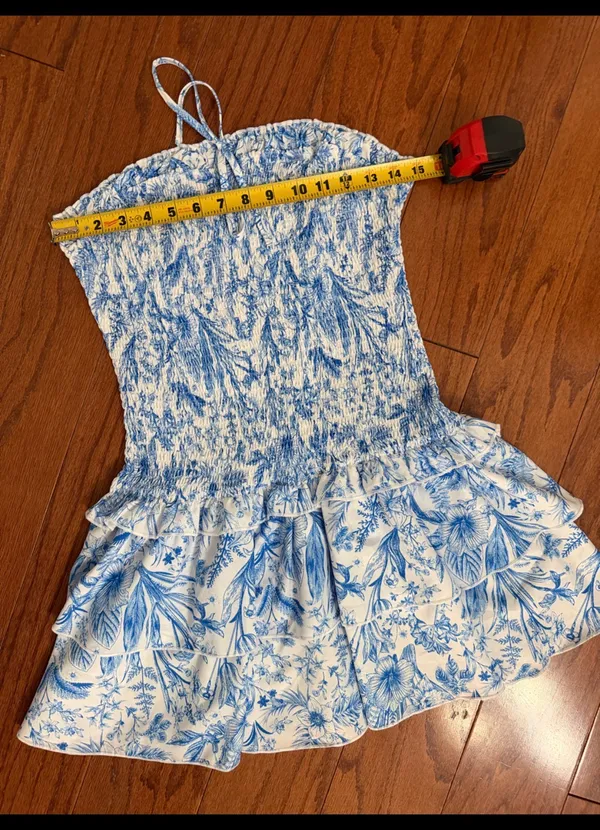 SHEIN Blue & White Floral Print Double Ruffle Hem Strapless Tube Dress -Size Med. Tiered Layer Ruffle Hem Tube Dress Sleeveless Tube Dress. Wear to a vacation, summer, spring outing, date night or party event. Super cute, gently warn & excellent condition. Measurements approximately 15” from armpit to armpit not fully stretched out from elastic x 25” long. Non-smoking home. Priced to sell at as is condition. Don’t like my price, make reasonable offer! - Image 7