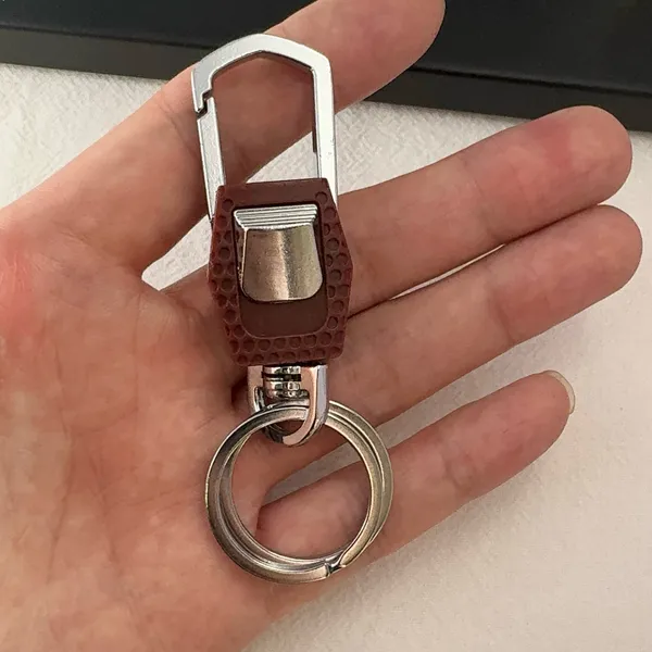 Practical carabiner keychain designed for both men and women for everyday carrying needs. Comes with double key rings, allowing you to classify and organize different keys separately. This keychain is 2.5 inches in length and 0.9 inches in width, compact and portable to carry around. Suitable for car keys, home keys, small gadgets, backpacks and handbags for convenient hanging. Simple versatile style matches various scenarios, a nice daily accessory and casual small gift. - Image 5