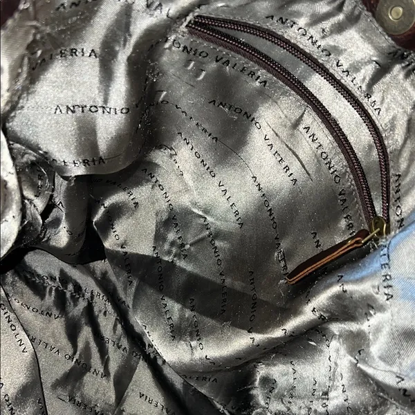 Antonio Valeria is a former Spacious Brown Leather Tote with Minimalist Design - Image 9