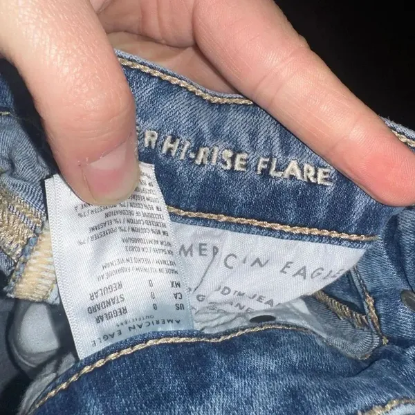American Eagle distressed 0 hi-rise flare raw hem jeans - Image 2