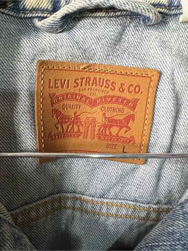 Levi’s Women’s Classic Trucker Light Wash Classic Distressed Denim Jean Jacket - Image 3