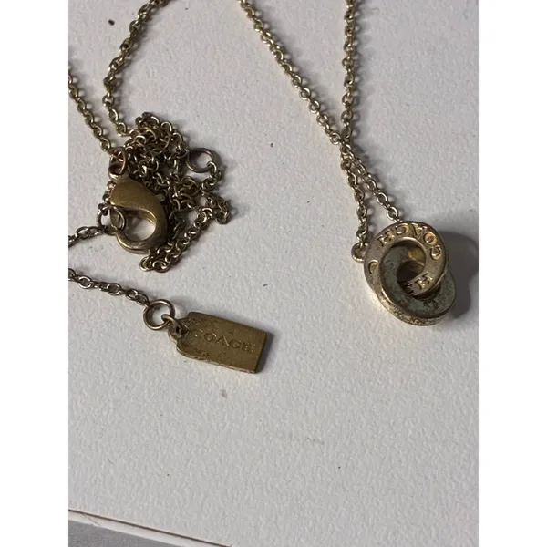 Coach Gold-Tone Interlocking Open Circle Pavé Crystal Pendant Necklace - Image 3