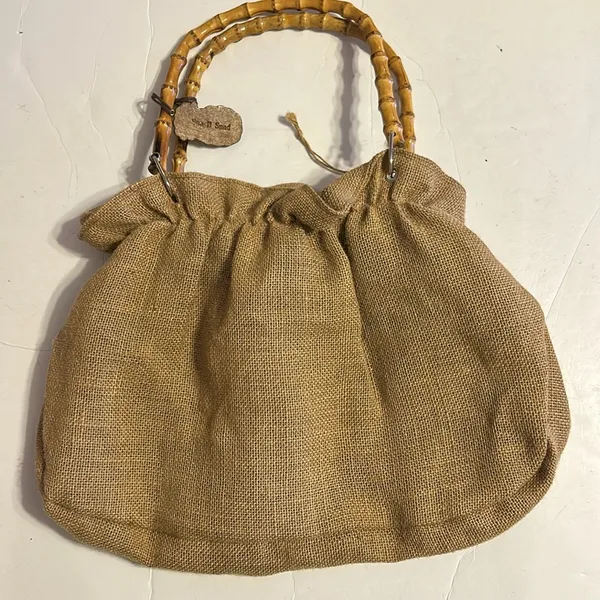 Tan purse made from burlap with beige flower and bamboo handles - Image 2