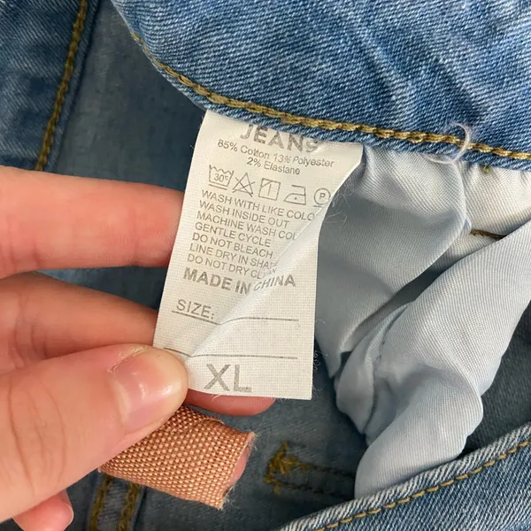 EUC Women’s medium/light wash‎ blue stretch flare leg distressed hem jeans XL - Image 6