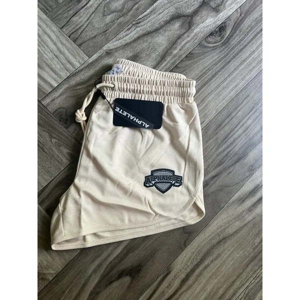 NEW Alphalete Woman’s Varsity Short - Tan ,size Medium - Image 6