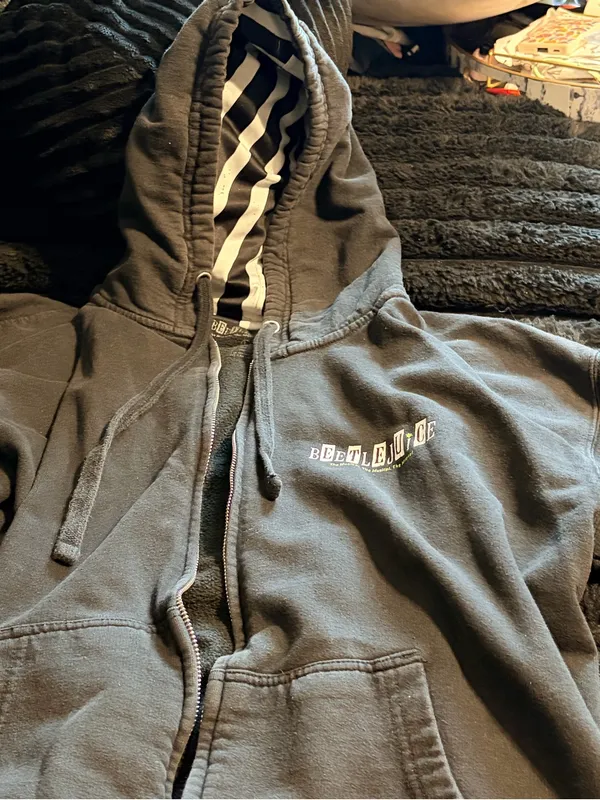 Black Zip Hoodie with Striped Hood Lining and Small Chest Logo - Image 2