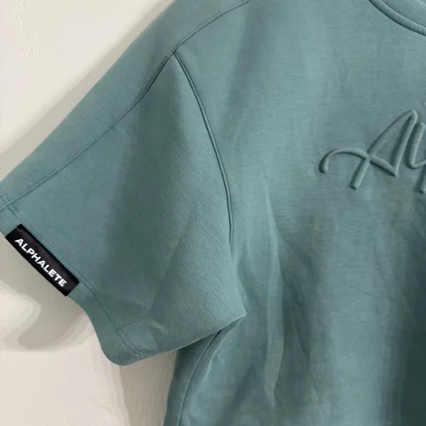 Alphalete Woman’s ELMTS Short Sleeve Crop Top Teal Blue Size Small - Image 4