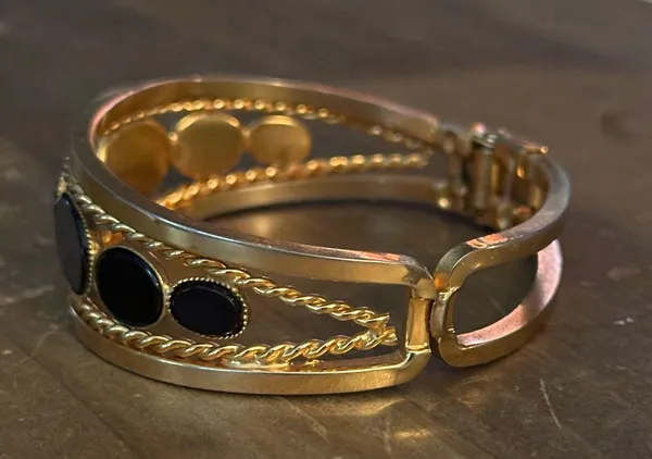 Gold tone open hinged bangle with oval black stones - Image 7