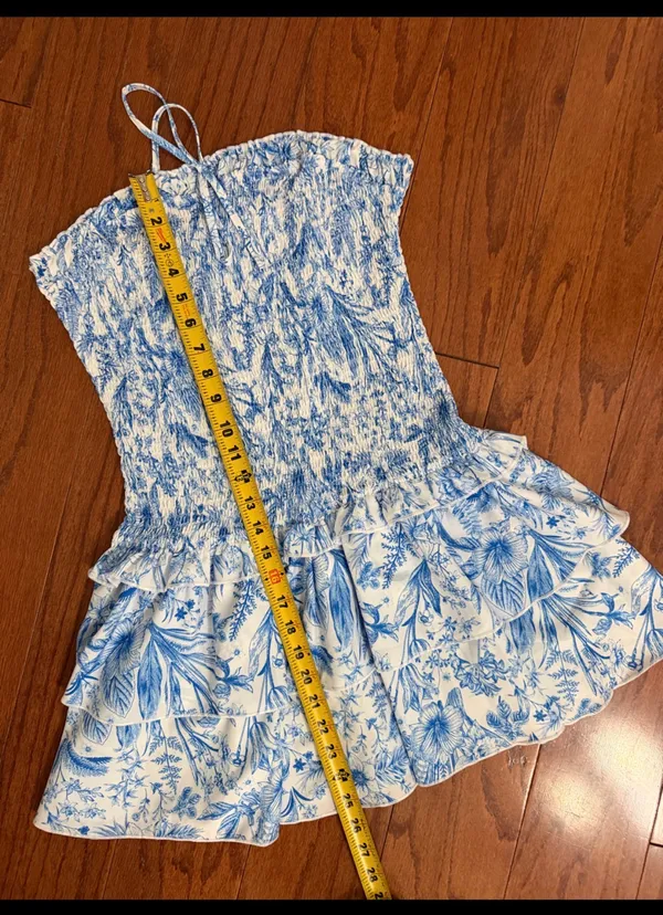 SHEIN Blue & White Floral Print Double Ruffle Hem Strapless Tube Dress -Size Med. Tiered Layer Ruffle Hem Tube Dress Sleeveless Tube Dress. Wear to a vacation, summer, spring outing, date night or party event. Super cute, gently warn & excellent condition. Measurements approximately 15” from armpit to armpit not fully stretched out from elastic x 25” long. Non-smoking home. Priced to sell at as is condition. Don’t like my price, make reasonable offer! - Image 8