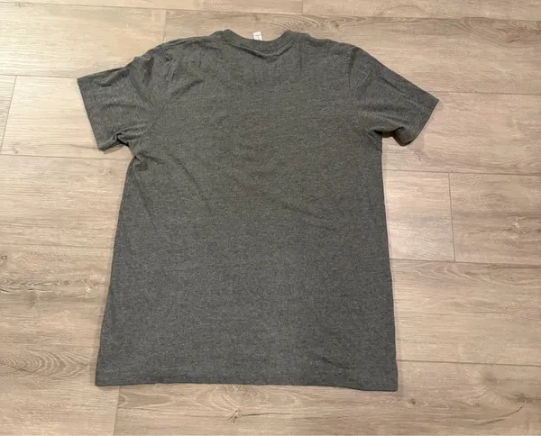 Cooper Alan Graphic Tee Heather Gray Women's Size Large Add this fan-favorite Cooper Alan graphic t-shirt to your collection! This official merchandise features the iconic "CA" logo in a circular crest on the chest, printed on a premium Bella + Canvas heather gray tee. Crafted for comfort, it has a classic crew neck and short sleeves, making it perfect for concerts or everyday wear. • Size: Large • Condition: Excellent pre-owned condition—worn but shows no flaws and is in perfect shape. • Brand: Bella + Canvas (Cooper Alan Merch) • Material: Soft, breathable cotton-poly blend. - Image 4