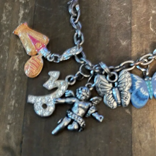 Silver tone loaded charm bracelet - Image 4