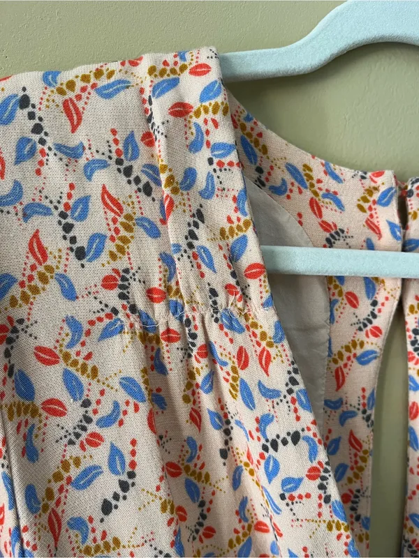 Free People Blush Pink Floral Print Romper with Blue & Red Accents - Image 4
