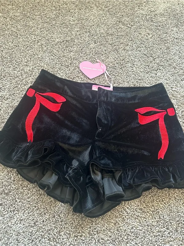 Sugar Thrillz Black Velvet Ruffle Shorts with Red Bow Accents - Image 2