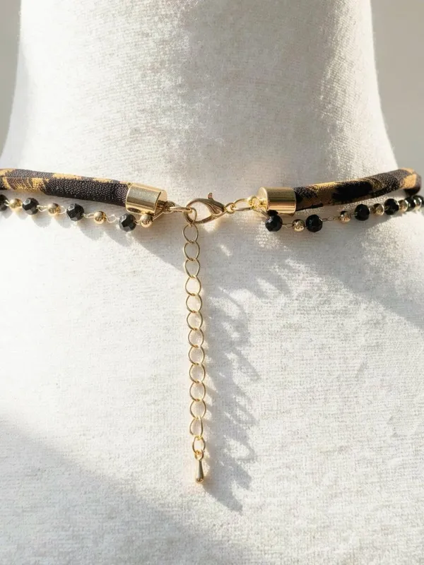 Leopard print necklace with gold cross and black beads - Image 4