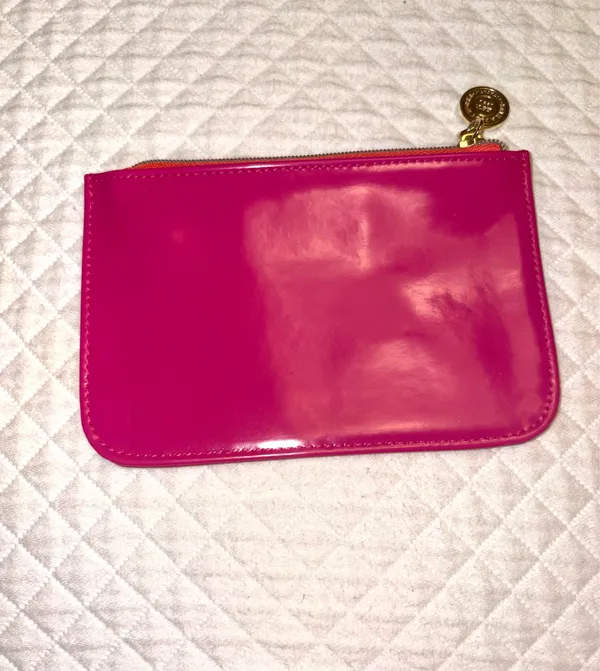 Small fuchsia pink patent leather makeup bag from Bath & Body Works with a gold metallic medallion pull. - Image 2