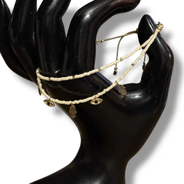 White beaded bolo bracelet with hamsa and evil eye charms - Image 3