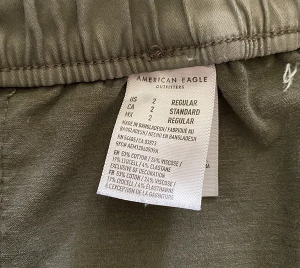 American Eagle -ARMY GREEN JOGGER PANTS-SIZE 2 Elastic waist with drawstring, zip front, two front and two back pockets, elastic ankles with a side zipper, excellent condition Measurements: Waist: side to side 13-16 inches Rise: 9 inches Inseam: 37 inches - Image 13