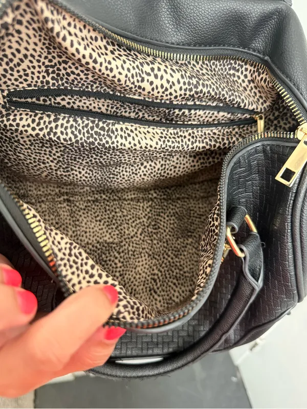 black woven duffle bag with gold hardware, some wear in the handles, no brand. - Image 3