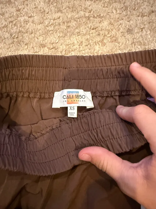 Brown athletic shorts with pink stripes and bows - Image 4