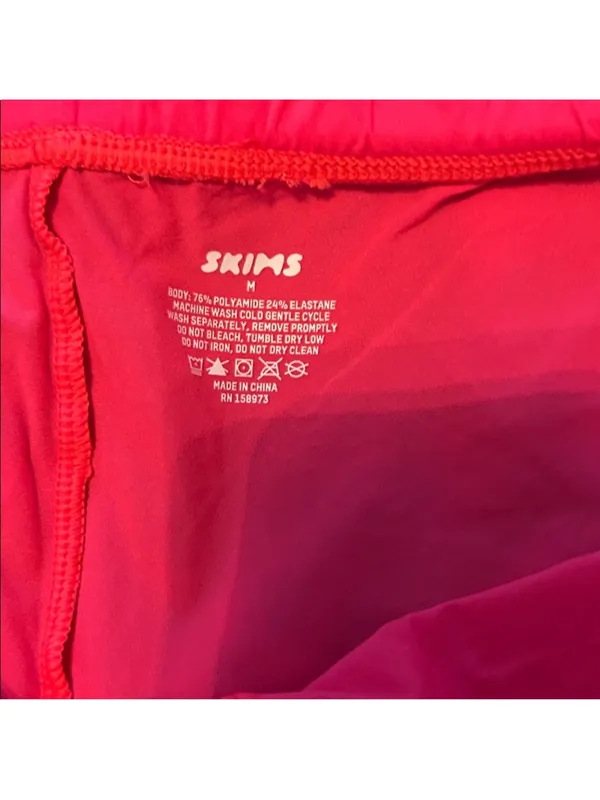 SKIMS Vibrant Coral Colored Thin Bike Shorts - Image 2