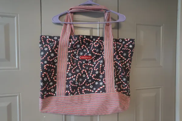 Mia and Tess candy cane and snowflake Christmas tote in black, red and white. - Image 5