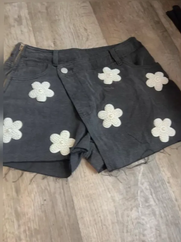 POL black denim skort features distinctive pearl-embellished flower details - Image 4