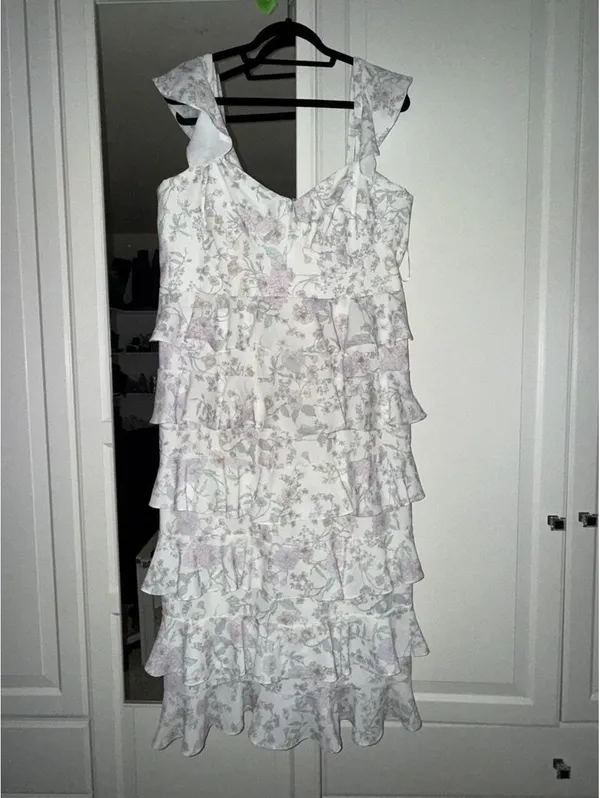 Eloquii bridal dress features a corseted bodice and tiered ruffled skirt. - Image 2