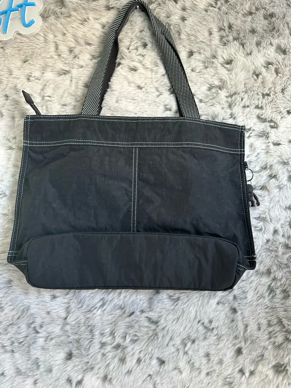 Kipling Ginnie Tote Bag black, prominent front pocket dual straps. - Image 4