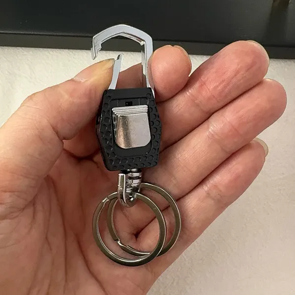 Practical carabiner keychain designed for both men and women for everyday carrying needs. Comes with double key rings, allowing you to classify and organize different keys separately. This keychain is 2.5 inches in length and 0.9 inches in width, compact and portable to carry around. Suitable for car keys, home keys, small gadgets, backpacks and handbags for convenient hanging. Simple versatile style matches various scenarios, a nice daily accessory and casual small gift. - Image 6