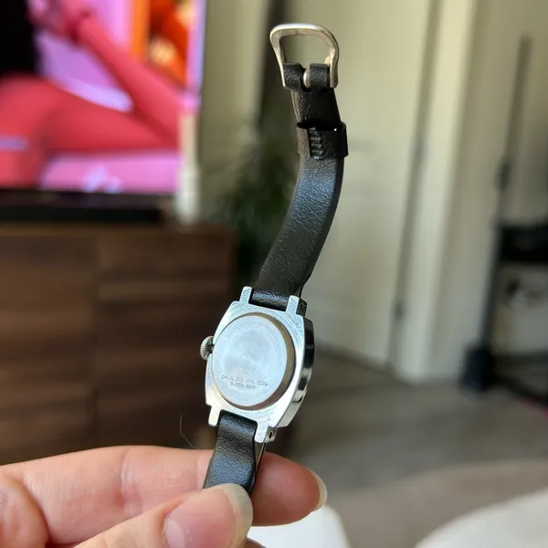 1970s silver vintage Timex women's mechanical winding watch featuring a cushion-shaped case and a leather band - Image 4