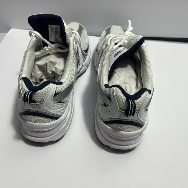 New Balance women’s sneakers in white and navy. Clean and stylish design with a comfortable cushioned insole and lace-up closure. Made in Vietnam. Size 9 US (40.5 EU / 25.5 CM). Great for everyday wear, walking, or casual outfits. Excellent condition - Image 10