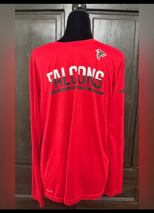 Nike NFL Falcons unisex longsleeves Dri-Fit t-shirt- size Large. Gently warn and excellent condition. Priced to sell at as is condition. Measurements approximately 20” from armpit to armpit x 26” long. Non-smoking home. Don’t like my price, make reasonable offer! And thank you for checking my closet. - Image 2