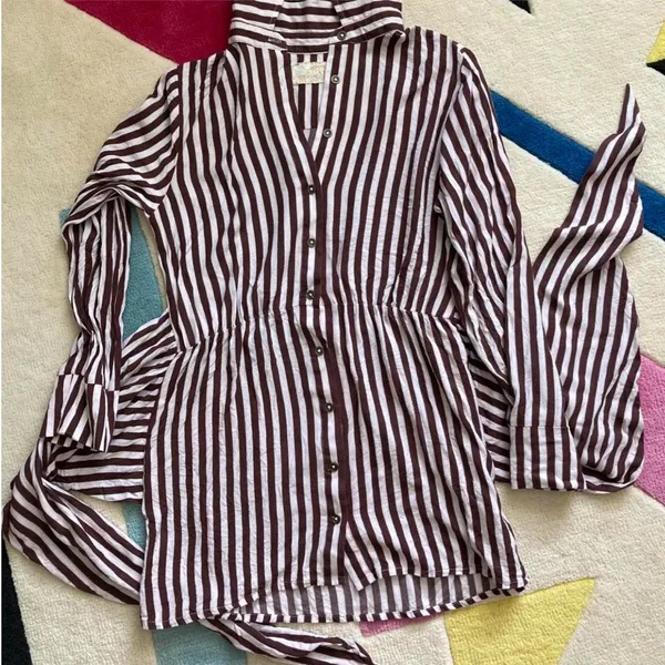 Jen’s Pirate Booty Amaya brown and white striped mini dress in size XS. This has only been worn once and has no rips, tears, or stains. Some color transfer between stripes from washing but it’s not really noticeable as seen in photos. The waist can be tied in front with excess or in back (I like to go around twice and tie in back). Ultra soft and flowy material, love this dress and only selling as it just isn’t quite my style. Measures 30” long, 17” across chest, 14” across at waist, 22” long sleeve (from shoulder seam). - Image 5