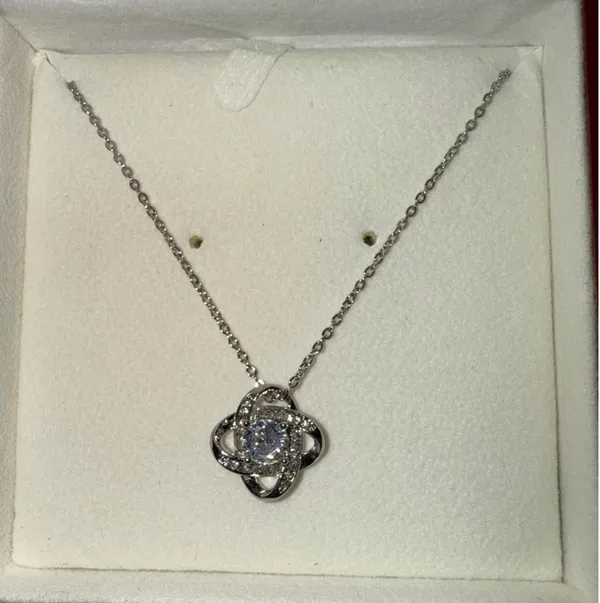 Silver diamond necklace with light showcasing gift box - Image 2