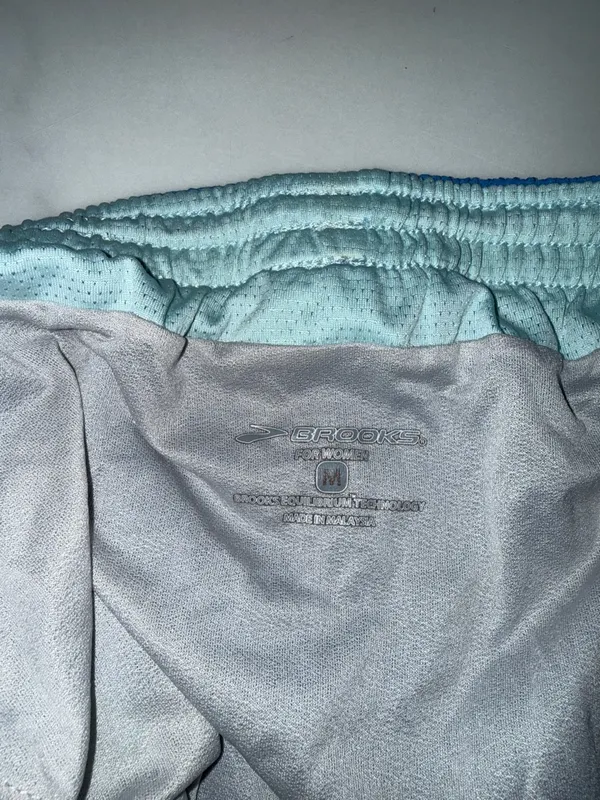 Brooks Women's Blue Running Shorts with Mint Panels and Cream Trim - Image 4