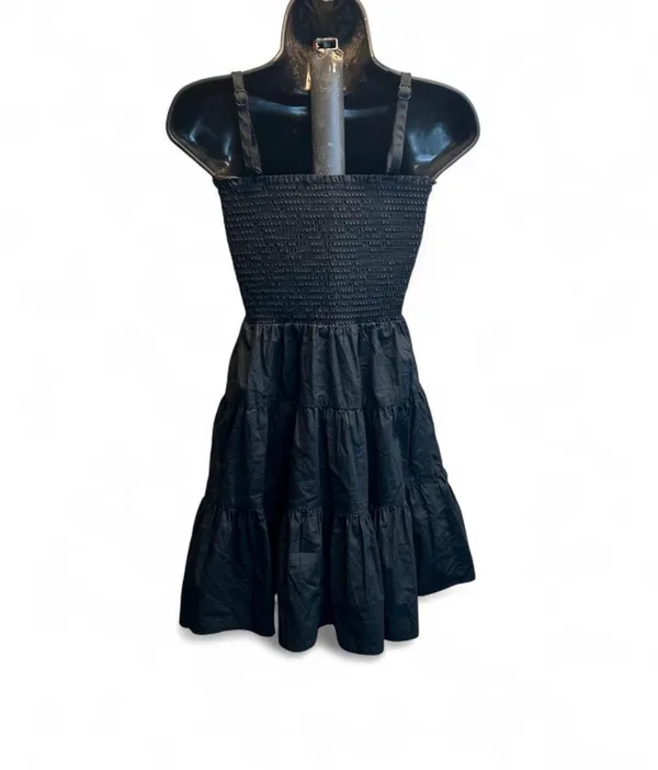 Steve Madden Smocked square neckline with thin straps. Tiered A-line skirt for movement. Lightweight, breathable fabric. Easy to dress up or down. - Image 2
