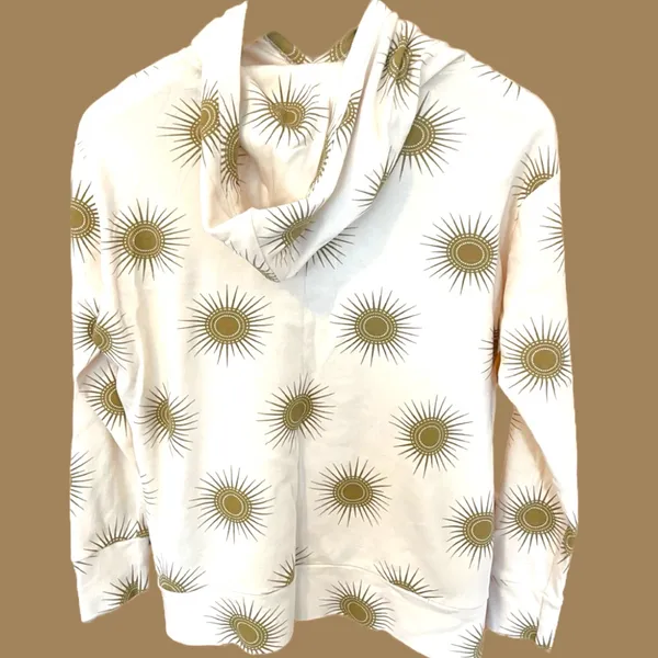 Kate Quinn Cream Hoodie with Gold Sunburst Pattern - Image 2