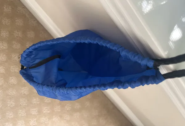 Blue drawstring bag. Measures 17 1/2 inches long x 13 inch wide - Image 3