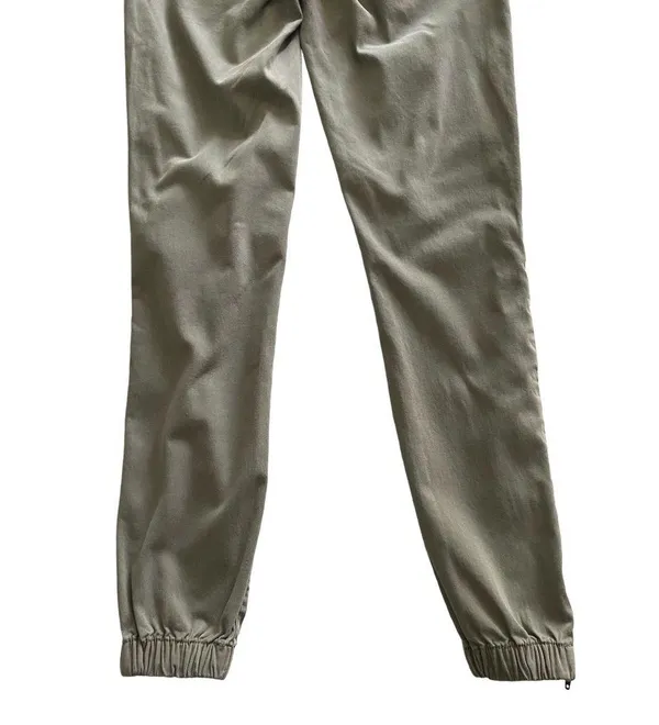 American Eagle -ARMY GREEN JOGGER PANTS-SIZE 2 Elastic waist with drawstring, zip front, two front and two back pockets, elastic ankles with a side zipper, excellent condition Measurements: Waist: side to side 13-16 inches Rise: 9 inches Inseam: 37 inches - Image 9