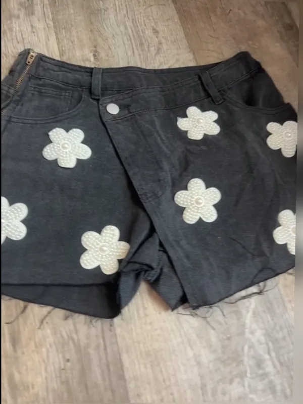POL black denim skort features distinctive pearl-embellished flower details - Image 2