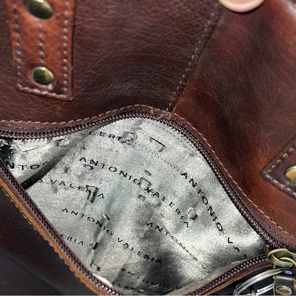 Antonio Valeria is a former Spacious Brown Leather Tote with Minimalist Design - Image 12