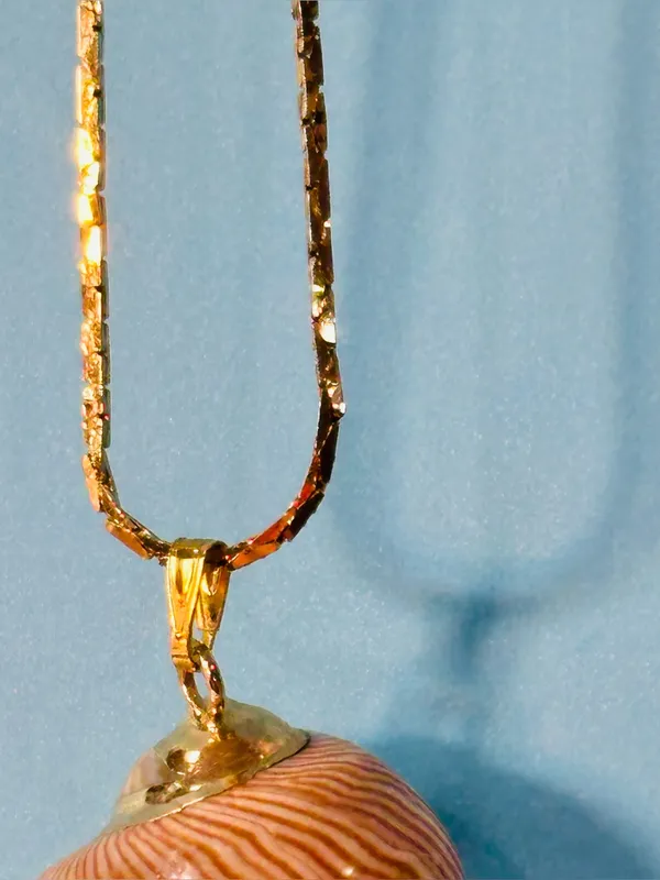 Gold Layered Necklace with Beige Swirl Pendant - Image 4