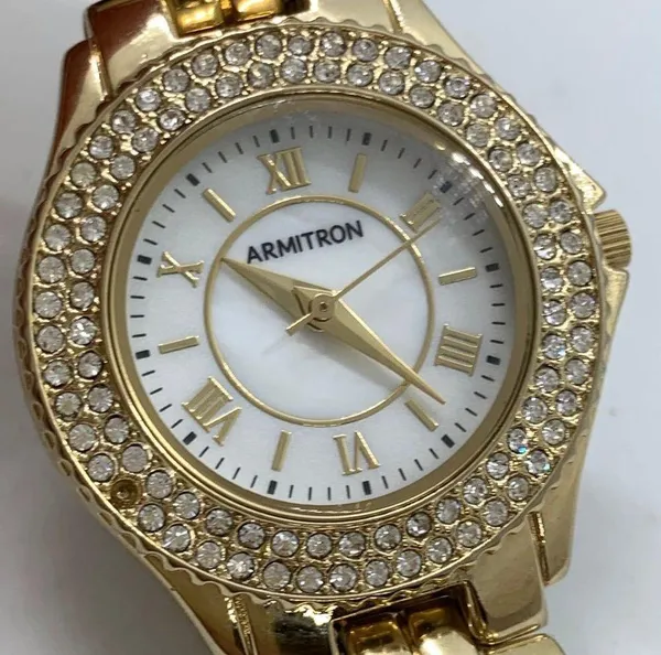 Armitron 27mm ladies Quartz analog WR watch gold tone MOP dial 6.5”-7” - Image 2