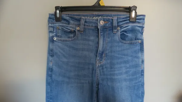 American Eagle Outfitters next level stretch super hi-rise flare jeans in medium wash blue size 4. - Image 5