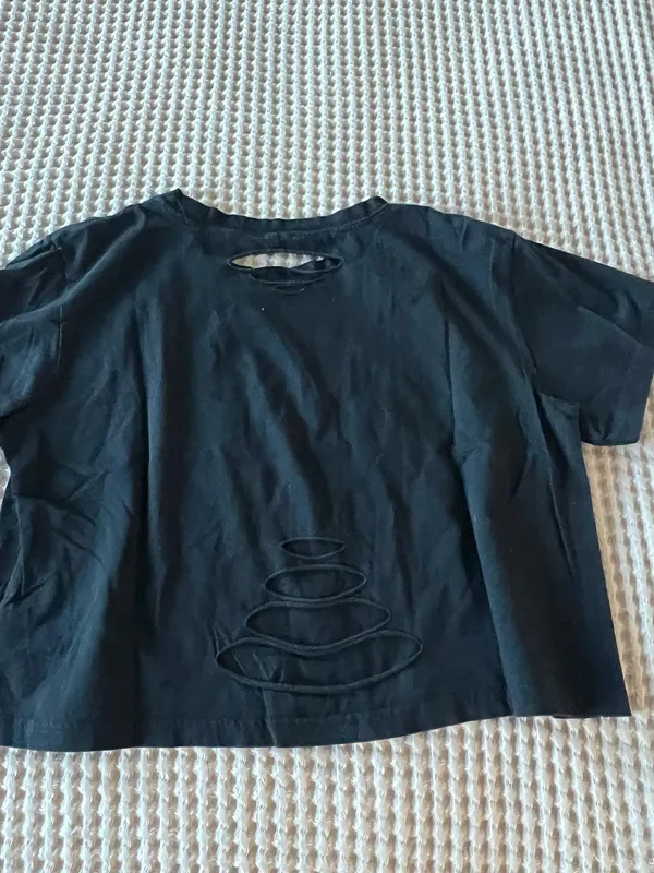 Black crop top with cutout detail and stacked stone graphic #cutout #stone - Image 2