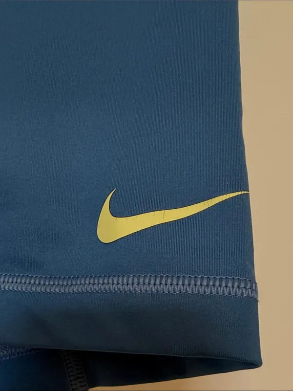 Nike Blue Compression Shorts with Black Waistband and Yellow Swoosh - Image 2
